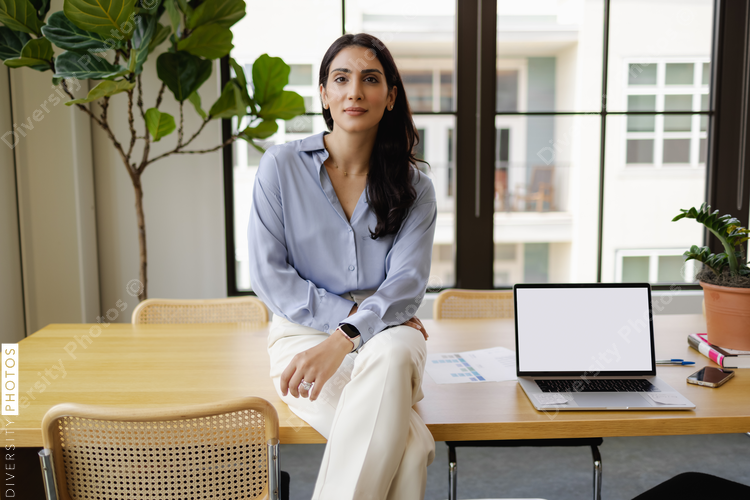Middle Eastern Businesswoman, confident, visionary, leadership in modern office