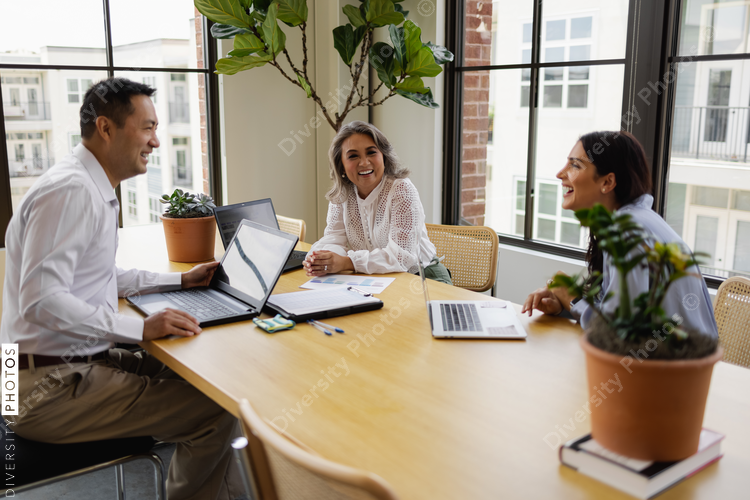 Multiethnic small business team gathered for a meeting