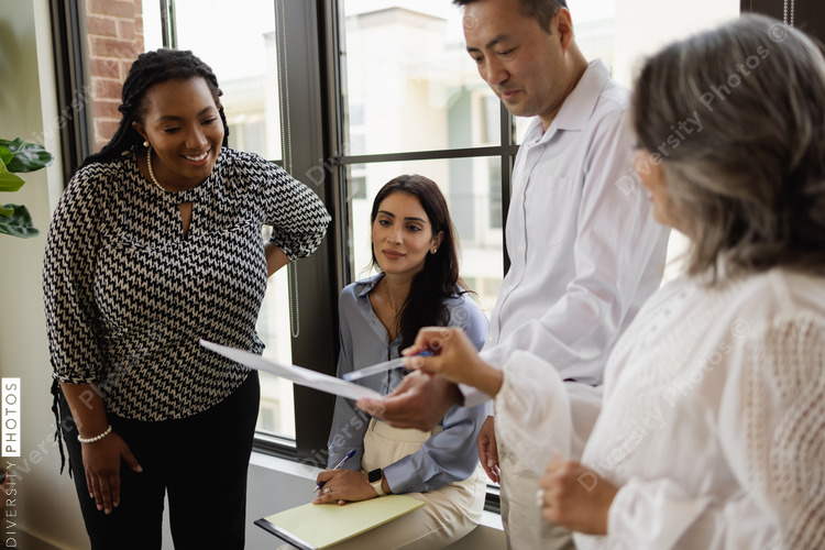 Diverse group having informal team meeting