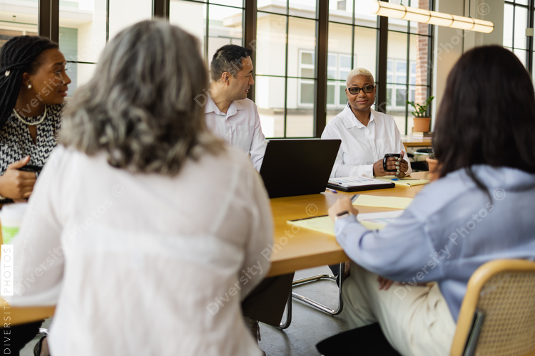 Multiethnic group having team meeting in office