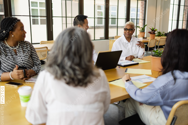Multiethnic group having team meeting in office