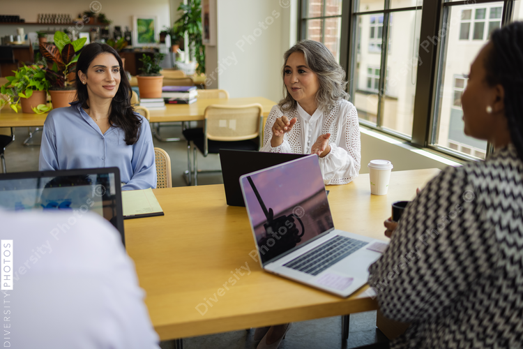 Chinese business leader, having discussions with team, female