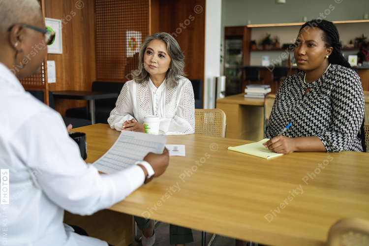 Multiethnic business women having informal company meeting, small business