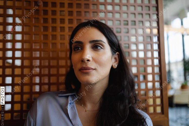 Portrait of adult Middle Eastern woman, business, leadership, visionary with copy-space 
