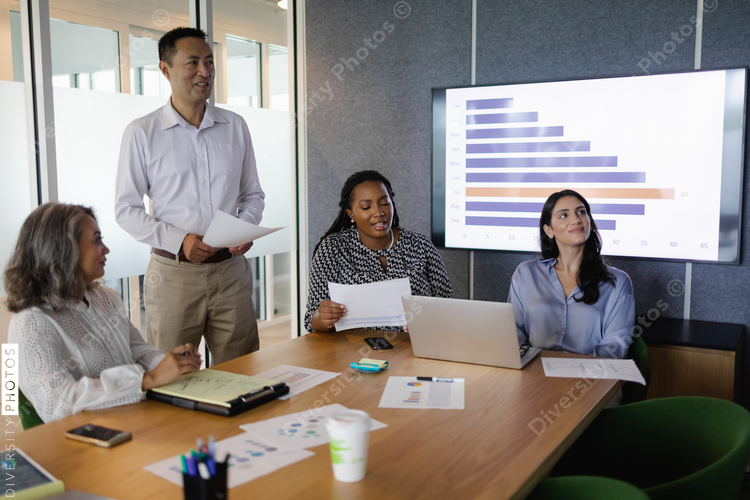 Diverse business team brainstorming and collaborates in conference room, senior Black woman leadership