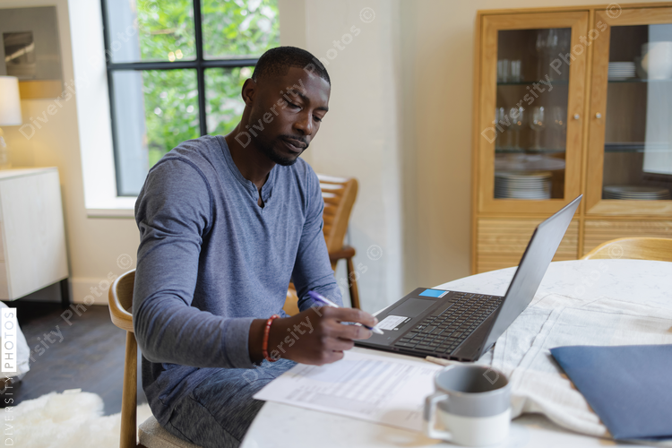 Man working on laptop at home