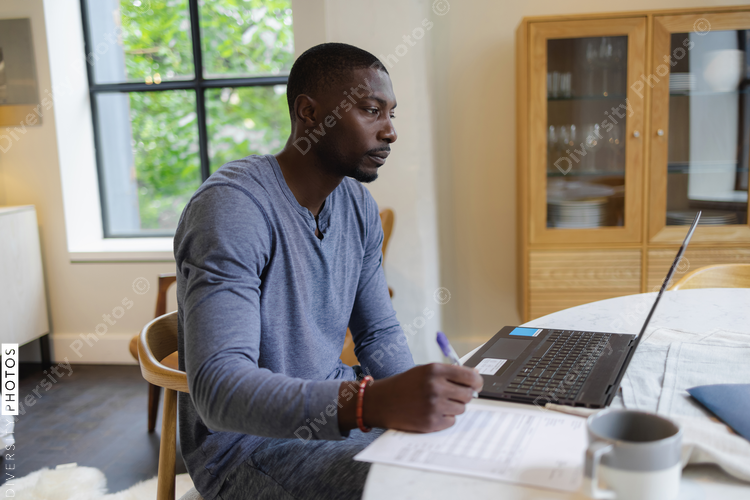 Man working on laptop at home