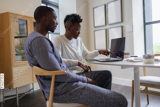 Black Couple using laptop at home for meeting
