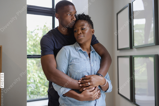 African American Couple embracing at home