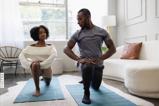 Young couple stretching in living room
