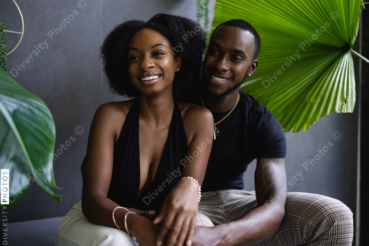 Elegant young couple among plants