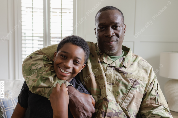 Feeling happy dad is home, family is complete, African American military, father and son