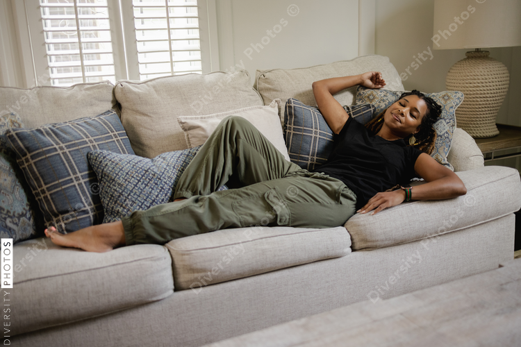 Black Woman relaxing on sofa