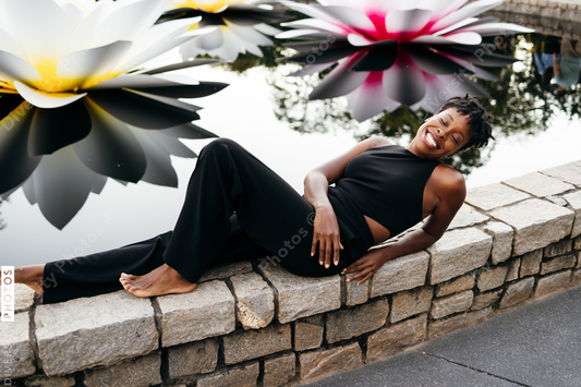 African American woman laying down relaxing, serene