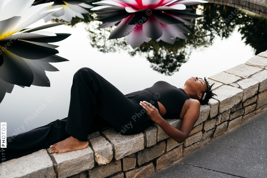 African American woman laying down relaxing, serene