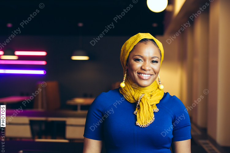 Portrait of smiling businesswoman standing in office