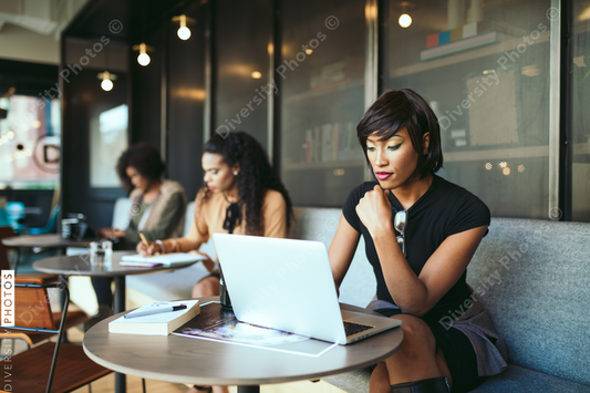 Young businesswoman working on laptop in office