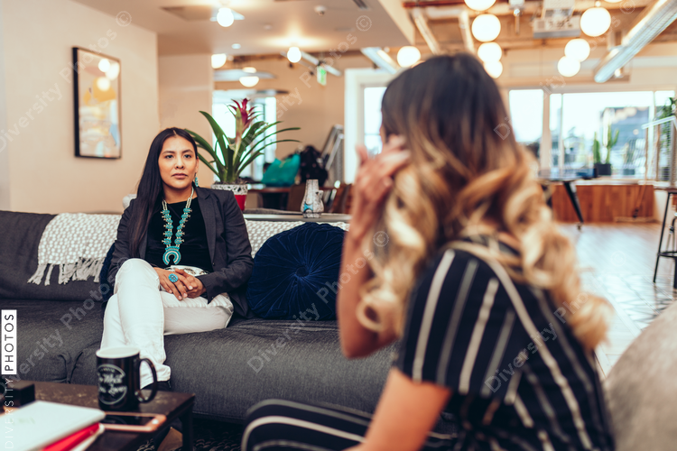 Businesswomen talking in modern office