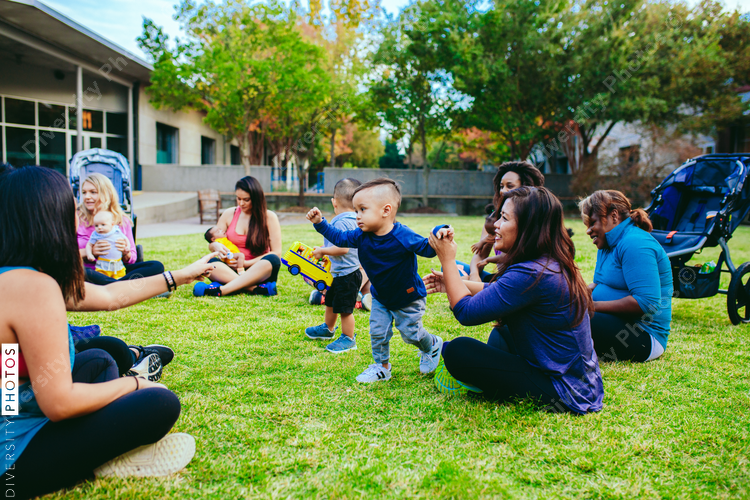 Women sitting with their children in the park