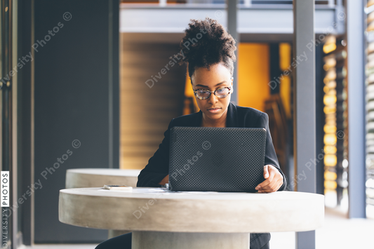 Young businesswoman working on laptop in office