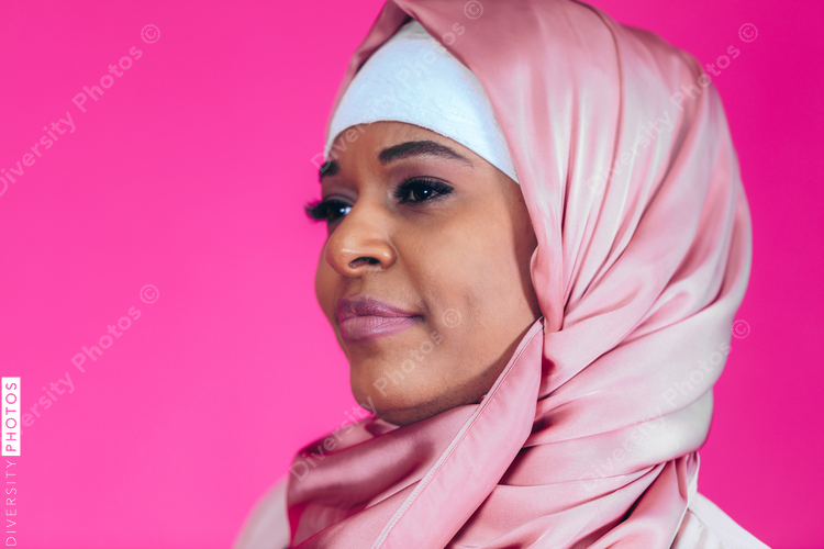 Close up of woman against pink background