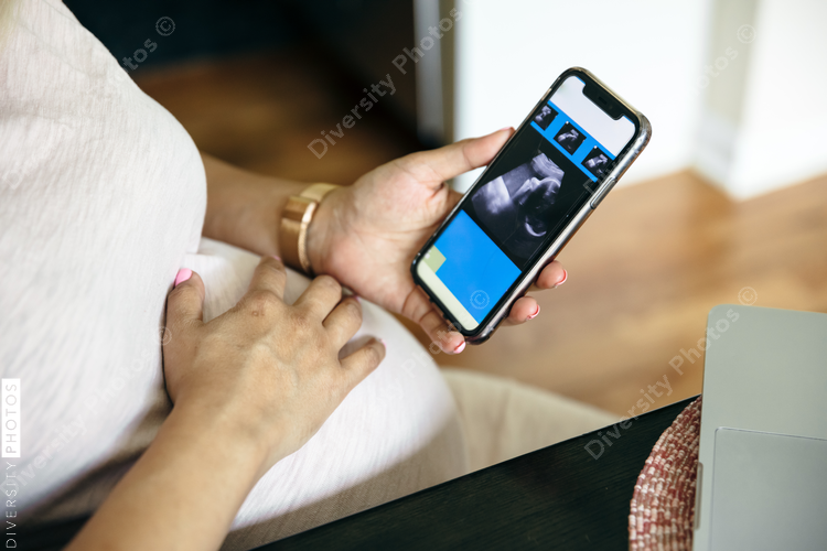 Pregnant woman looking at sonogram