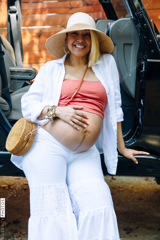 Beautiful pregnant woman in third trimester traveling