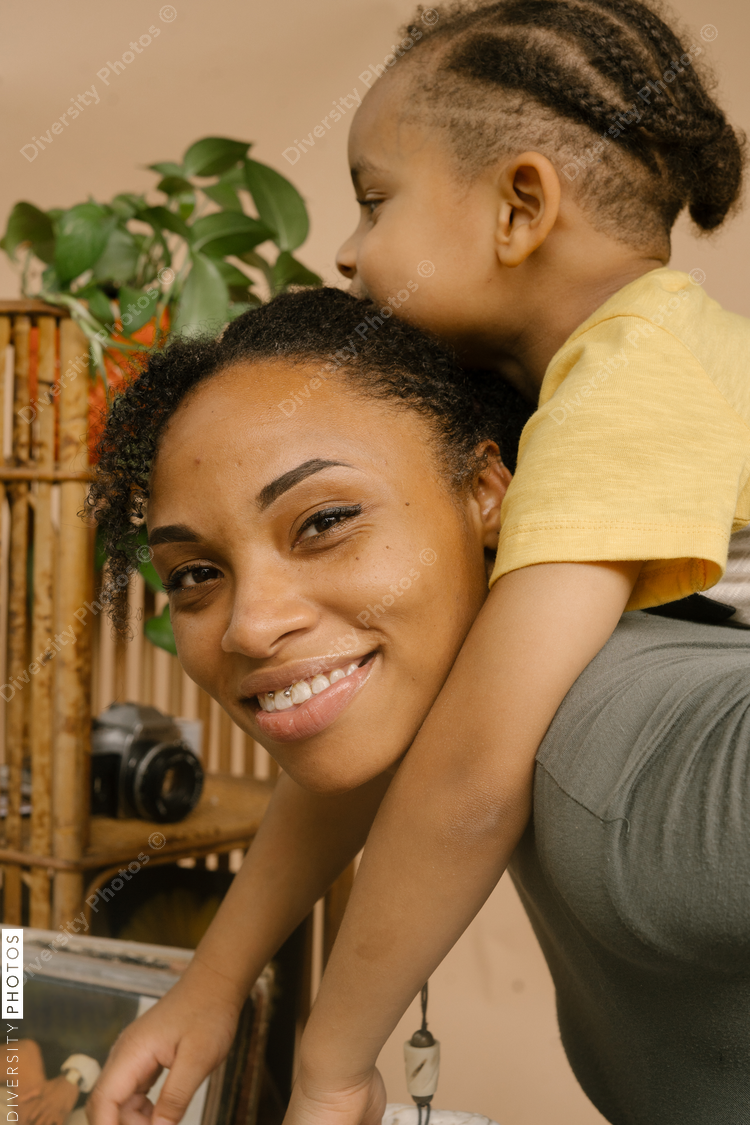 Black mother and son sharing a happy moment at home
