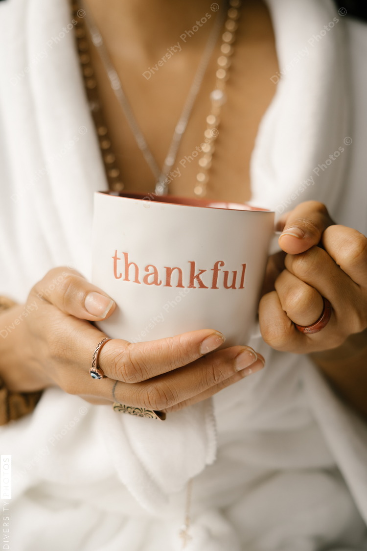 Woman drinking coffee at home in bed
