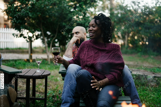 Black friends safely gathered and enjoying a backyard kickback party