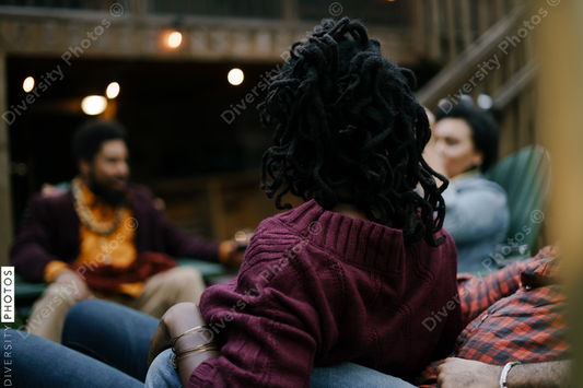 Black friends safely gathered and enjoying a backyard kickback party