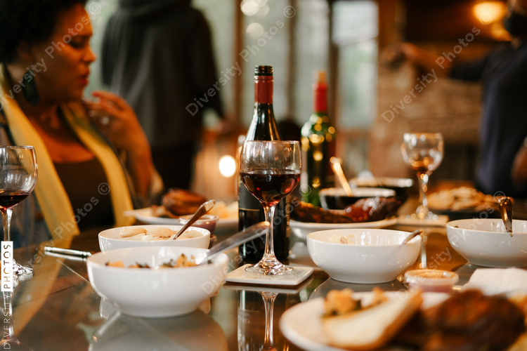 Friends eating BBQ together safely in vacation pod