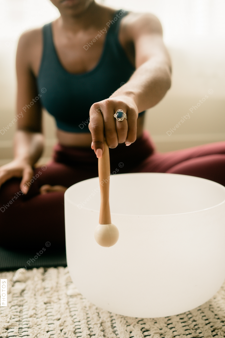 Woman using stress relieving singing bowl