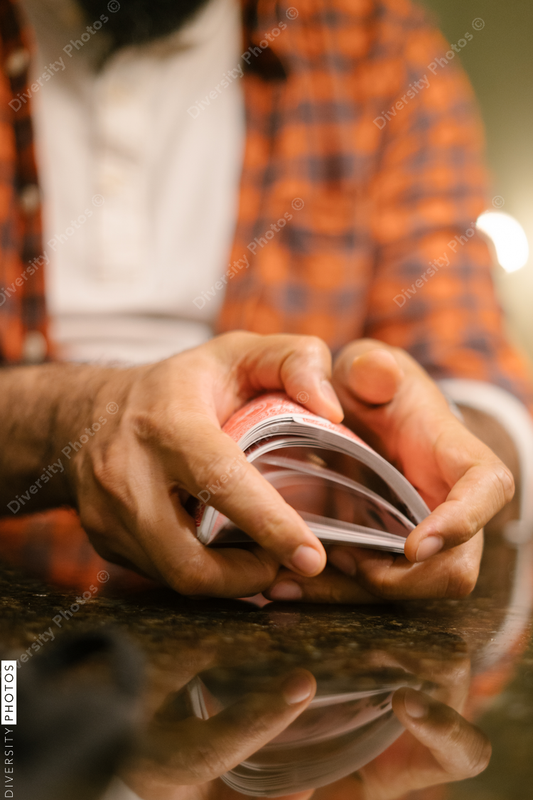 Black male hands shuffling and dealing playing cards