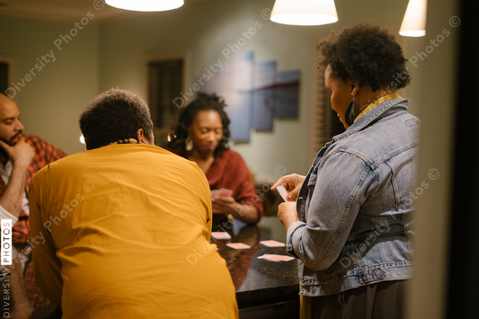 African American friends together playing card games