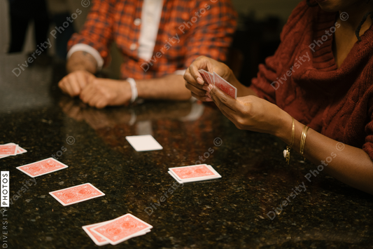 African American friends together playing card games