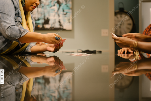 African American friends together playing card games