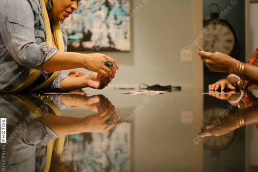 African American friends together playing card games