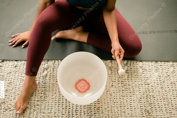 Woman using stress relieving singing bowl