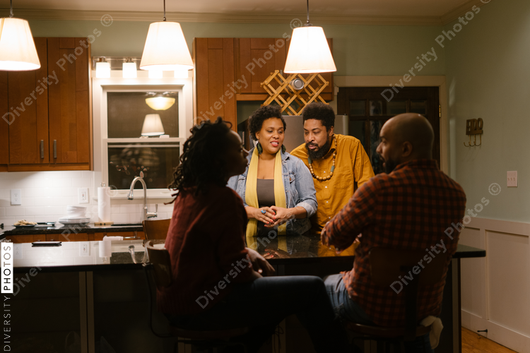 African American friends together playing card games for date night