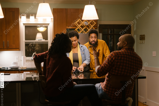 African American friends together playing card games for date night