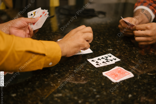 African American friends together playing card games