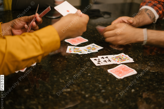 African American friends together playing card games