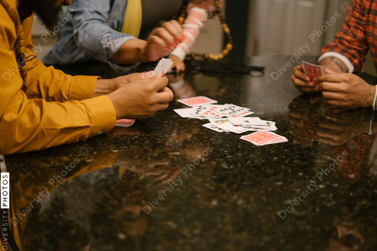 Black friends together playing card games