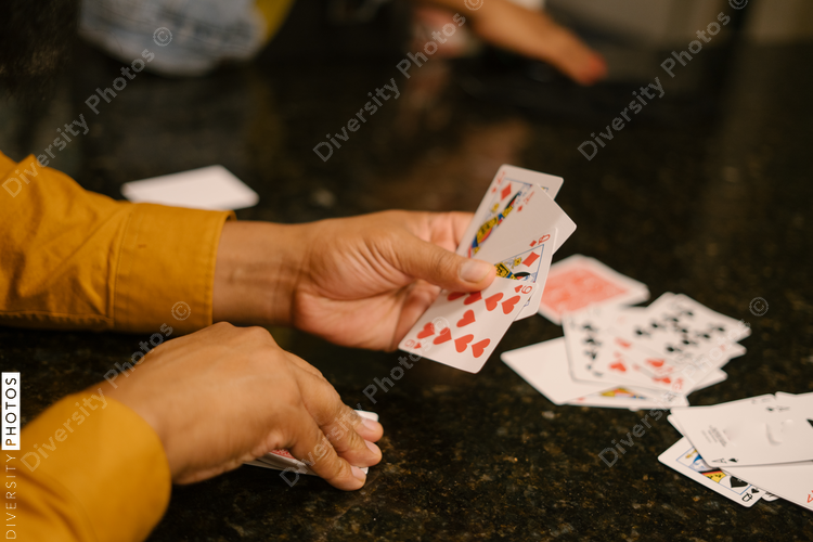 Black friends together playing card games