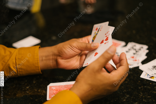 Black friends together playing card games