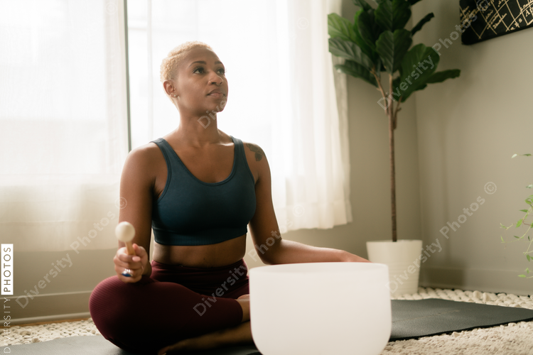 Black woman meditating at home