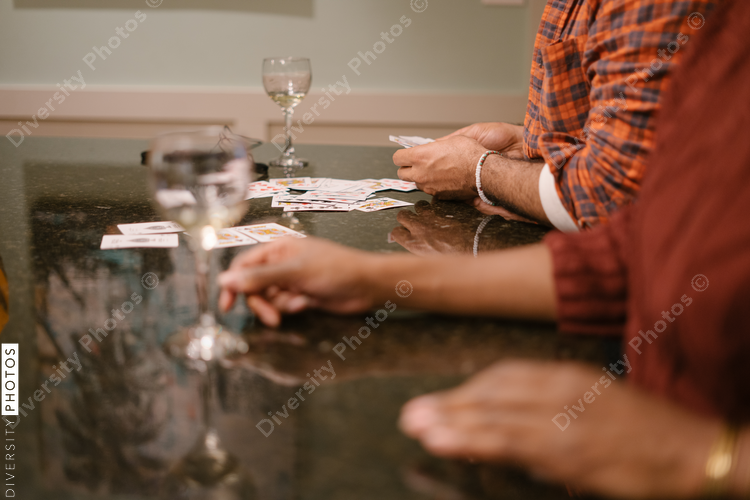 Friends drinking wine and playing card games