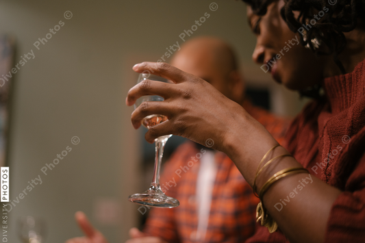 Black friends enjoying wine and time together at home