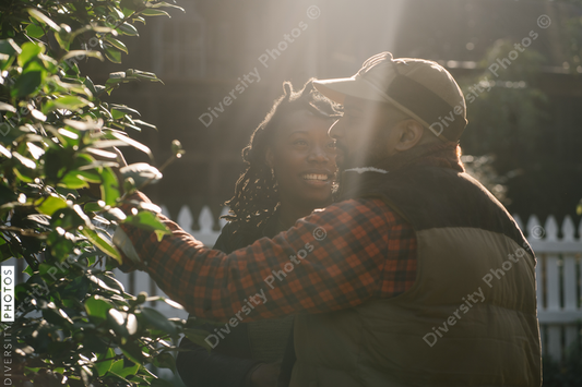 Beautiful black couple outside home at sunrise